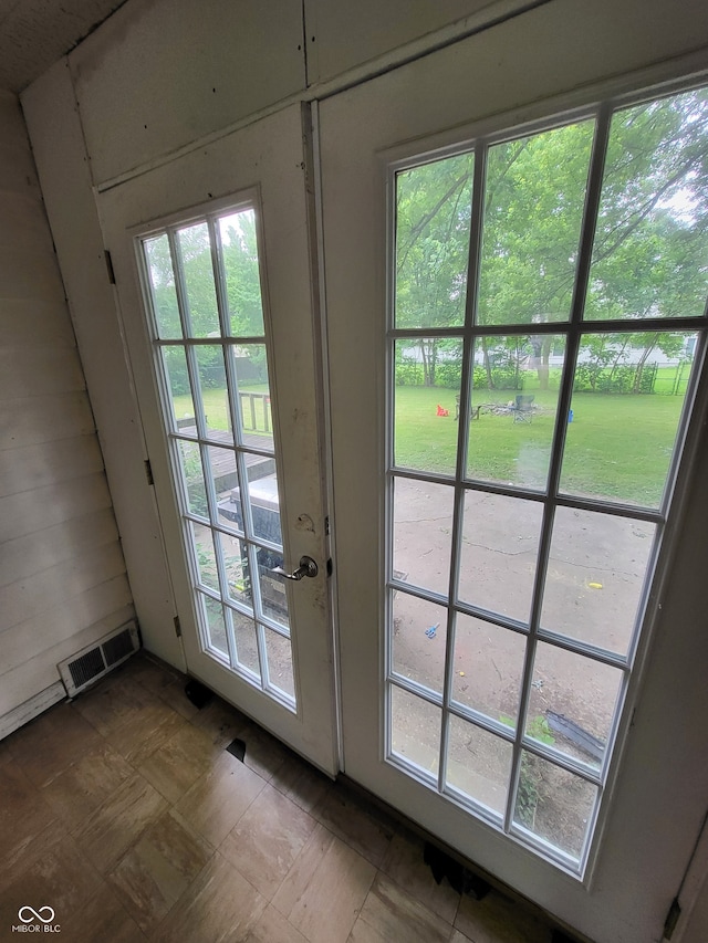 doorway featuring tile floors and french doors