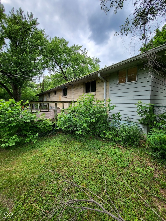 view of yard featuring a wooden deck