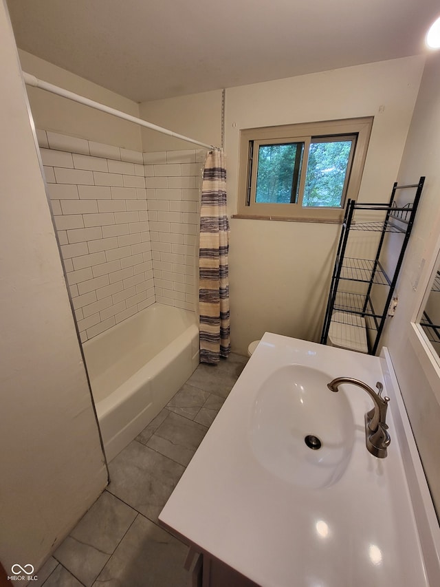 bathroom featuring tile flooring, shower / tub combo with curtain, and vanity