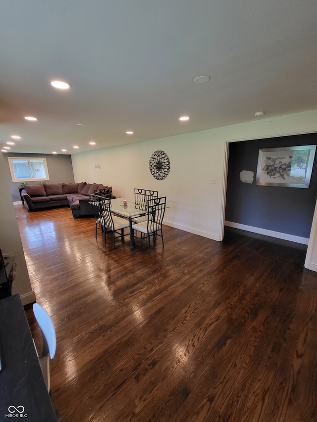 dining space featuring dark hardwood / wood-style flooring