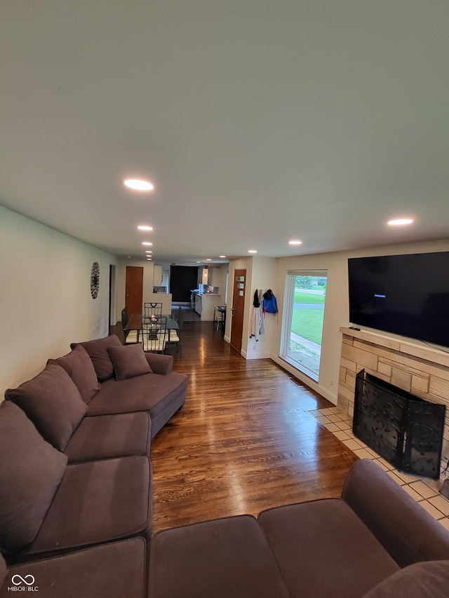 living room featuring a fireplace and hardwood / wood-style floors