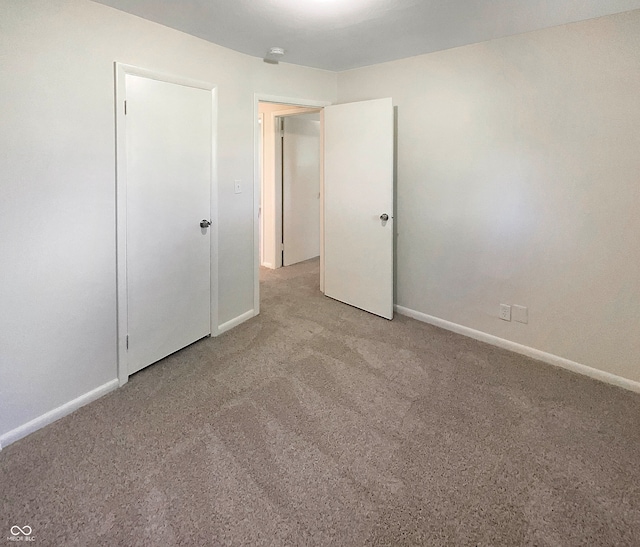 unfurnished bedroom featuring carpet flooring