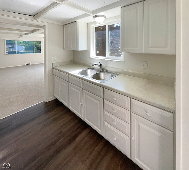 kitchen featuring a textured ceiling, white cabinetry, sink, and dark wood-type flooring