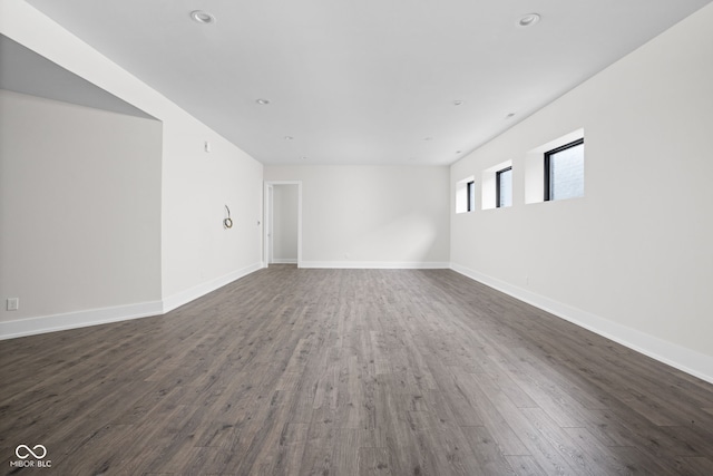 spare room with dark hardwood / wood-style flooring