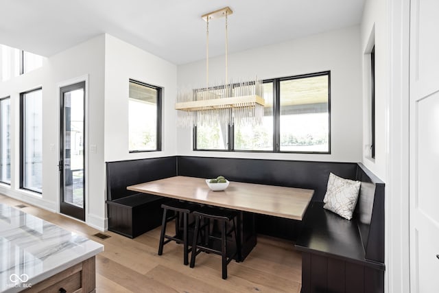 dining room with breakfast area and light hardwood / wood-style flooring