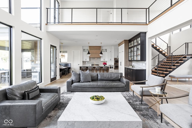 living room featuring a high ceiling