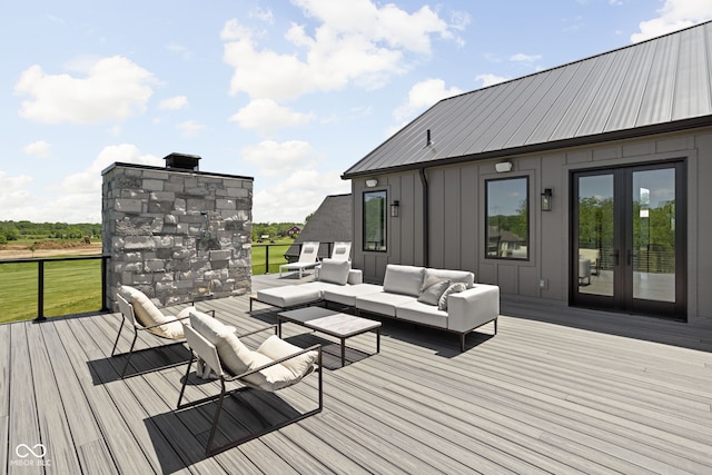 wooden deck featuring outdoor lounge area