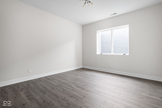 empty room with wood-type flooring