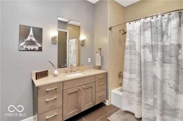 bathroom featuring vanity, shower / bath combo, and tile floors