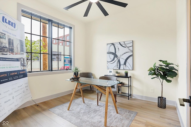 home office featuring ceiling fan and light hardwood / wood-style floors