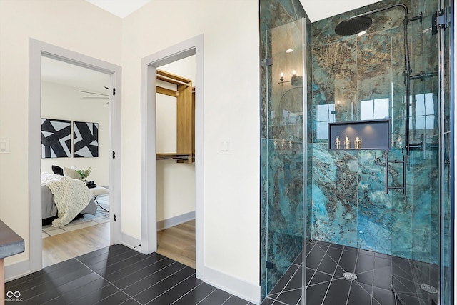 bathroom featuring hardwood / wood-style flooring, walk in shower, and ceiling fan