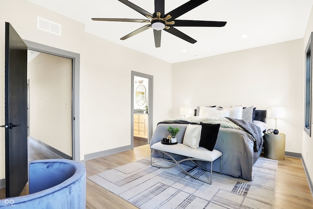 bedroom with light hardwood / wood-style floors and ceiling fan