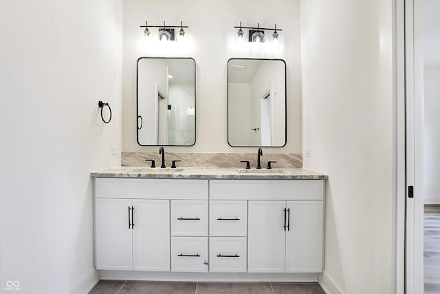 bathroom with tile patterned flooring and vanity