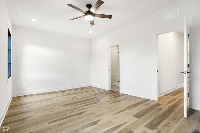 unfurnished room with ceiling fan and light hardwood / wood-style floors