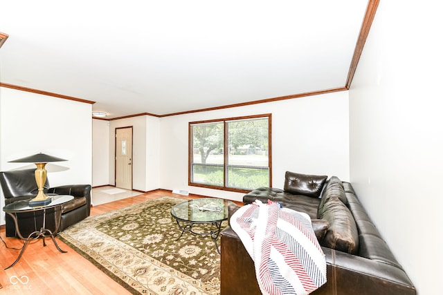 living room featuring crown molding and wood-type flooring