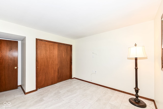 unfurnished bedroom featuring a closet