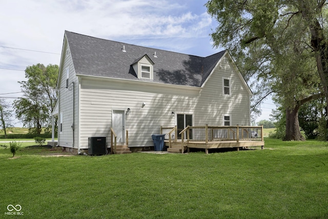 back of house featuring a wooden deck, cooling unit, and a yard