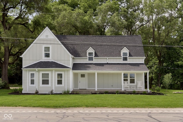 view of front of home featuring covered porch and a front yard