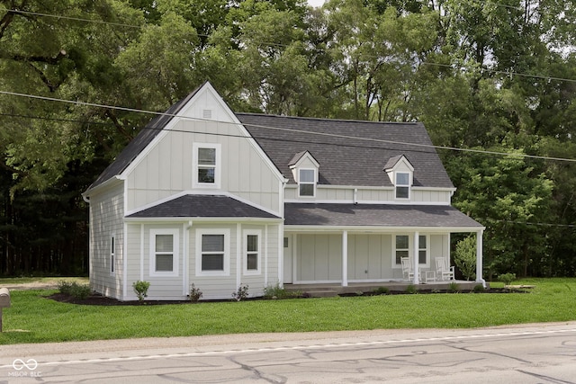 view of front of house featuring a front lawn and a porch