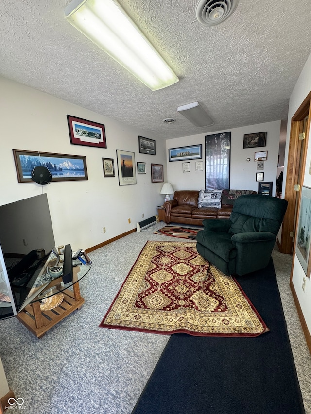 living room featuring carpet flooring and a textured ceiling