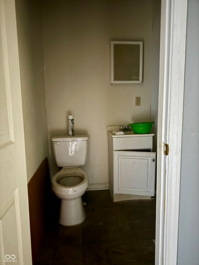 bathroom featuring toilet and tile patterned floors