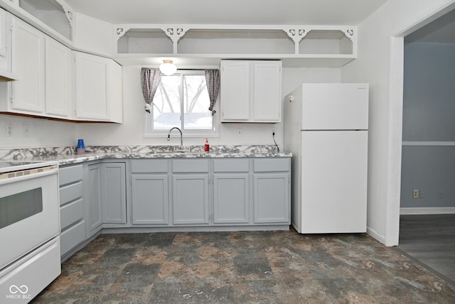 kitchen featuring white appliances, white cabinetry, baseboards, and a sink