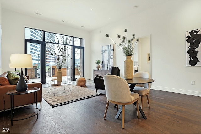 dining area with dark hardwood / wood-style floors