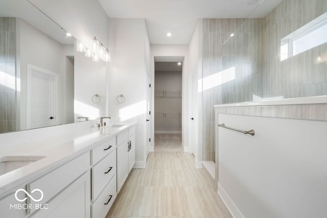 bathroom featuring vanity and walk in shower