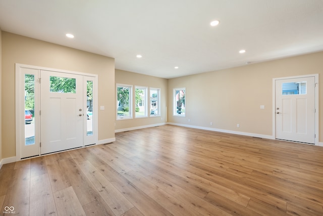 foyer with light wood-type flooring