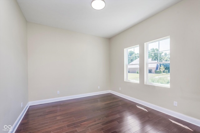 spare room featuring dark hardwood / wood-style flooring