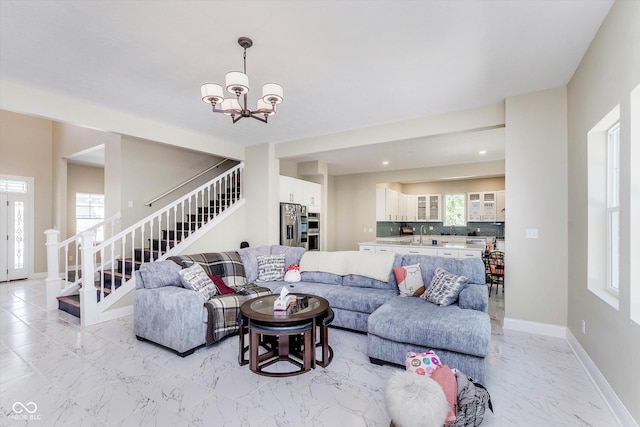 living room with a notable chandelier