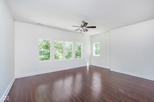 unfurnished room featuring dark hardwood / wood-style floors and ceiling fan