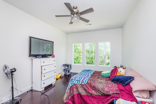 bedroom featuring dark hardwood / wood-style floors and ceiling fan