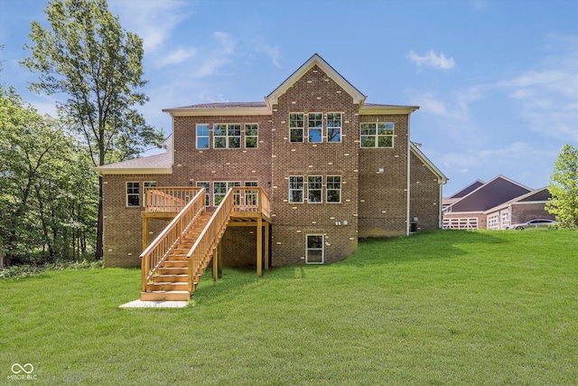 rear view of property with a yard and a deck