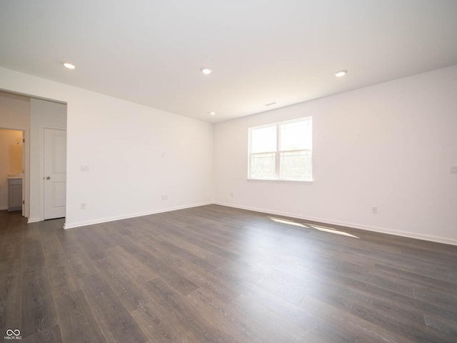 unfurnished room featuring dark hardwood / wood-style floors