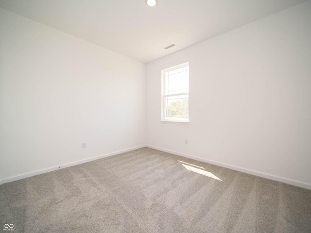 spare room with carpet