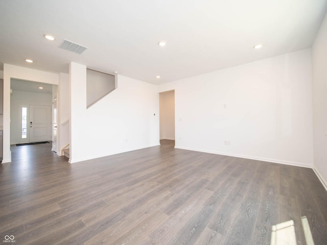 spare room with dark hardwood / wood-style flooring