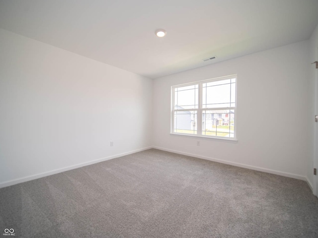 spare room featuring carpet flooring