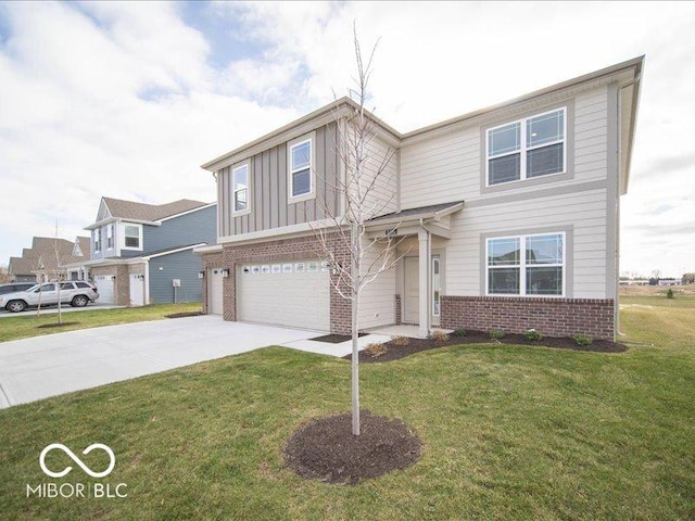 view of front of property with a garage and a front lawn