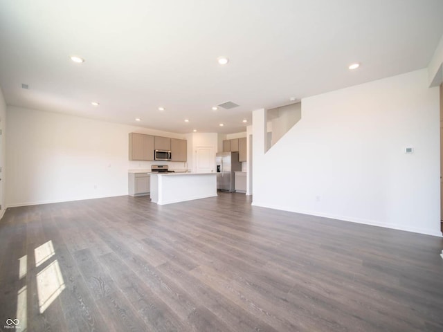 unfurnished living room with dark hardwood / wood-style floors