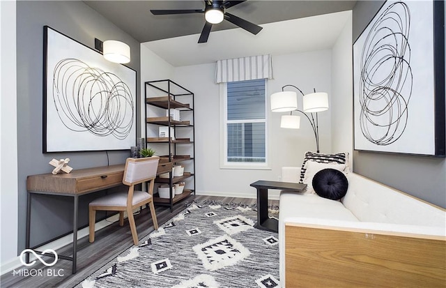 office space with ceiling fan and dark hardwood / wood-style flooring