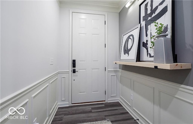 doorway with crown molding and dark hardwood / wood-style floors