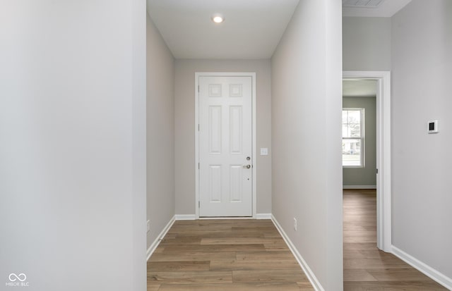 doorway with light hardwood / wood-style floors