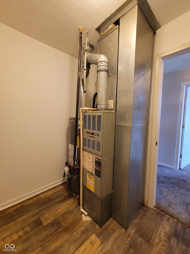 utility room featuring water heater