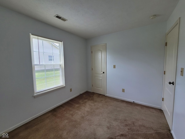 unfurnished room with light carpet