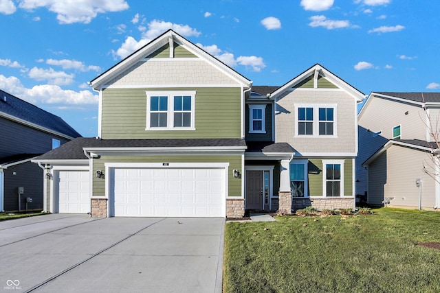 view of front of property featuring a garage and a front lawn