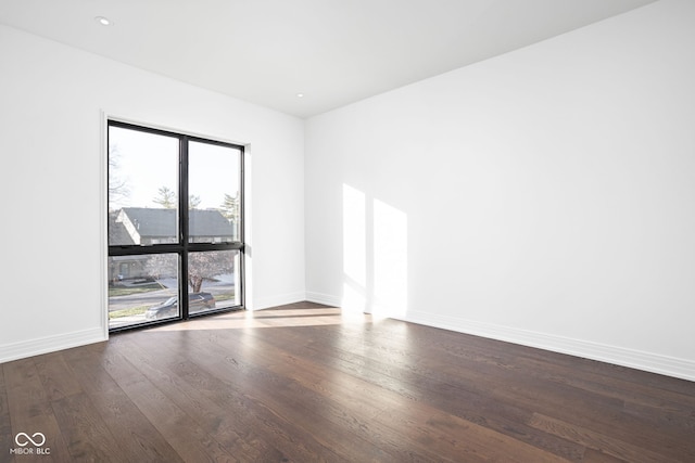 unfurnished room featuring wood-type flooring