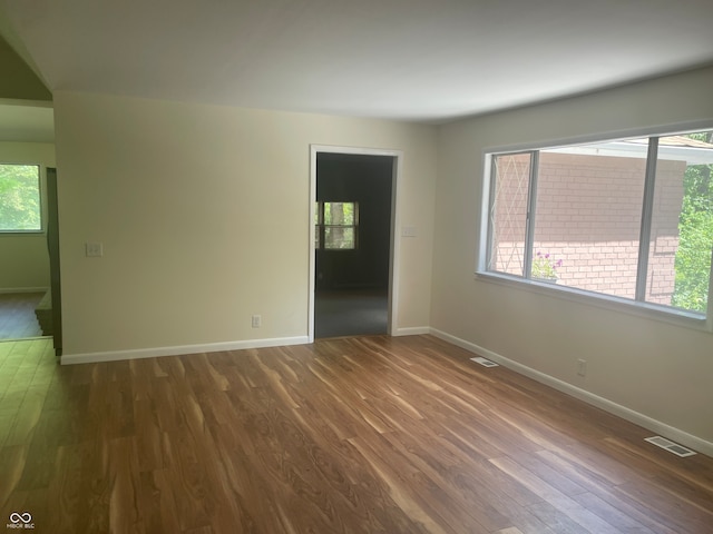 empty room featuring hardwood / wood-style flooring