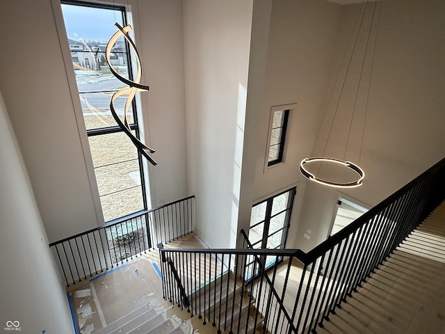 stairs featuring a high ceiling