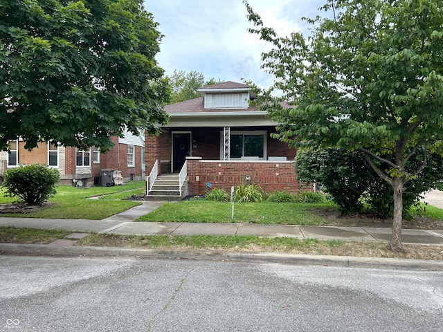 bungalow with a front yard